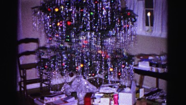 1967: a heavily decorated christmas tree with gifts pile underneath HAGERSTOWN