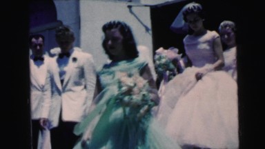 1964: wedding party leaving church in formal dress CAMDEN, NEW JERSEY