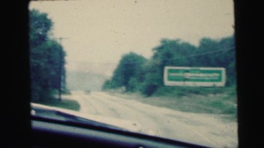 1964: foggy day and a road to a lake through a forest CAMDEN, NEW JERSEY