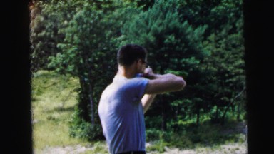 1964: garden scene flowers pretty multi colour people playing shooting CAMDEN