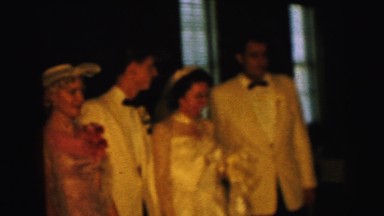 1964: members of wedding party pose during celebration CAMDEN, NEW JERSEY