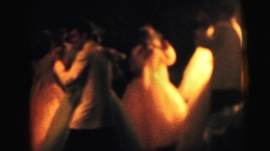 1964: a bride and groom braced as they begin cutting the wedding cake CAMDEN