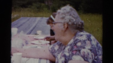 1964: family members eating pie at picnic table in green grass field CALIFORNIA