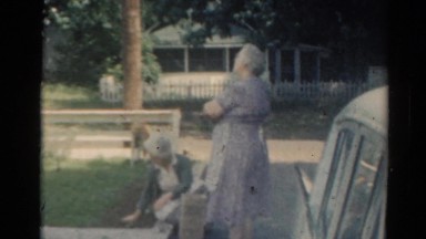 1964: cars are seen passing by a building mother viewing CALIFORNIA