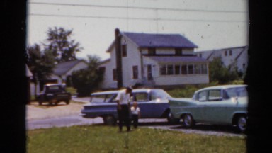 1964: a house and a car and people are walking from it CALIFORNIA