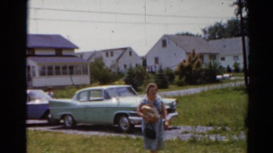 1964: visitors are exiting vehicles and arriving at their destination
