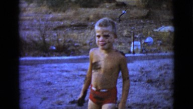 1968: a cute little boy outdoor in the yard playing in the mud CLARKSDALE