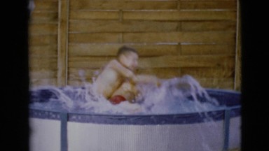 1968: swimming kids mini pool outdoor fun siblings CLARKSDALE, ARIZONA
