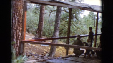 1968: people on a wooden deck overlooking a beautiful wilderness area