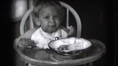 1942: Cute Baby Learning to Eat with Mom's Help in New York