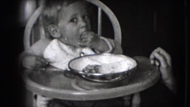 1942: Toddler in Highchair Eats Lunch from Bowl in New York