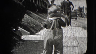 1942: a little girl is starting to walk outdoor. NEW YORK