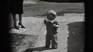 1942: a toddler outdoor attempting to walk before falling on butt NEW YORK