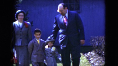 1951: a well-dressed family with children walking across the lawn CLEVELAND