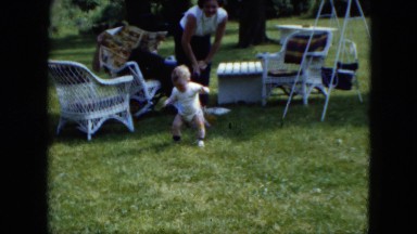 1951: family is spending day on a meadow with a cute baby CLEVELAND, OHIO