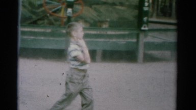 1962: A Cute Young Boy Walking Through a Playground Acting Silly Catskill