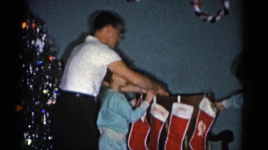 1962: mom with her kids busy with arranging tree for xmas CATSKILL, NEW YORK