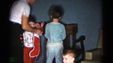 1962: a family gathers around to open gifts on christmas morning. CATSKILL