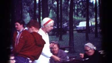 1964: people enjoying a picnic outdoor. CALIFORNIA