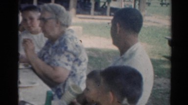 1964: a group of people have a get together and eat a meal CALIFORNIA