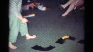 1964: while one does needlework, another reads and a child at play CALIFORNIA