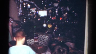 1964: kids are opening their christmas presents CALIFORNIA