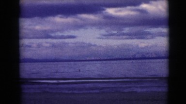1968: video showing ocean, beach, and clouds overhead CLARKSDALE, ARIZONA