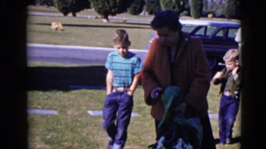 1968: woman and two children visit a grave site CLARKSDALE, ARIZONA