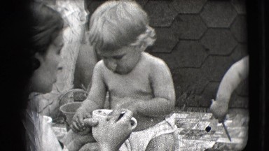 1942: mothers feeding their toddlers sitting on a mat NEW YORK