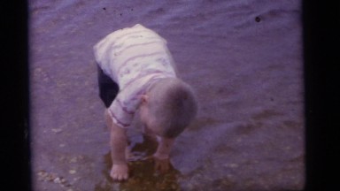 1965: a family with children playing and swimming in the water CAMDEN