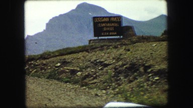 1967: beautiful land with large mountain range, hills, grassland and bushes