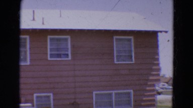 1968: the exterior of a large two story home and the surrounding yard DILLER