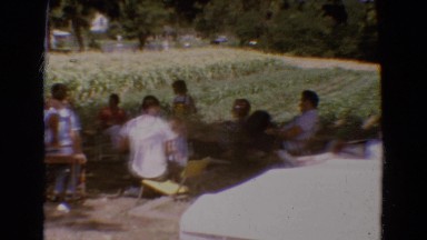 1968: people gathered outdoors at a large family picnic DILLER, NEBRASKA