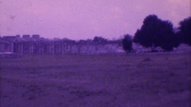 1973: deserted place with sparsely distributed trees and stony wall MEXICO