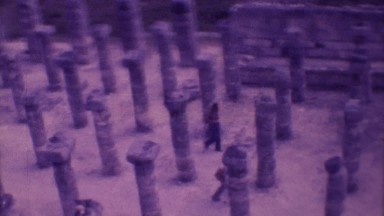 1973: people walking among many columns and statues in a valley