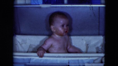 1951: a cute little baby taking a bath in a portable tub CLEVELAND, OHIO