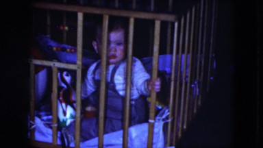1951: a beautiful smiling baby is standing up and paying attention CLEVELAND
