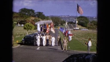 1966: men walking down a street in a cemetery for a military funeral CALIFORNIA