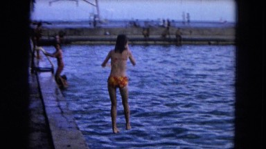 1966: people playing in a swimming pool along the coast CALIFORNIA