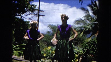1966: two women in grass skirts performing a hula dance CALIFORNIA