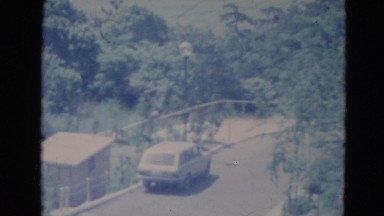 1976: A Lone Car Parked on a Tree-Lined Road in Minnesota