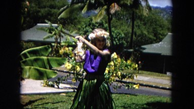 1966: A Young Funny Girl Dancing with Sticks Hawaii