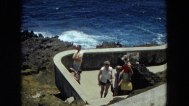 1966: crashing sea along the coastline as the family views it HAWAII