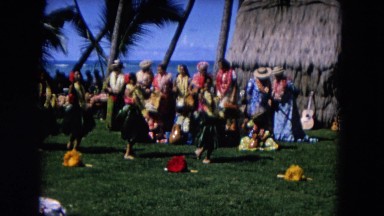 1966: girls dancing beautifully in their traditional style at a luauHAWAII