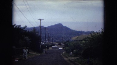 1966: the view of village at the base of a mountain under the clear sky HAWAII