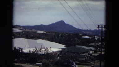 1966: a view of a city next to the mountains HAWAII