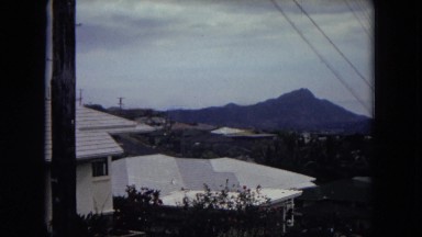1966: the view of village at the base of a mountain under the clear sky HAWAII