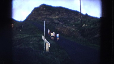 1966: mountain greenery with people walking up hill HAWAII