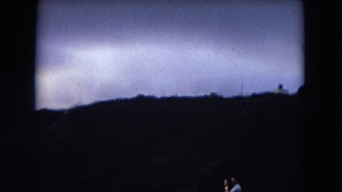 1966: panoramic view of mountains, a remote coastal area and the horizon HAWAII
