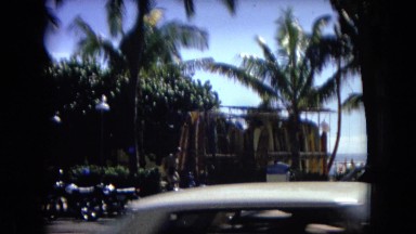1967: people walking along a busy city street in a tropical setting HAWAII